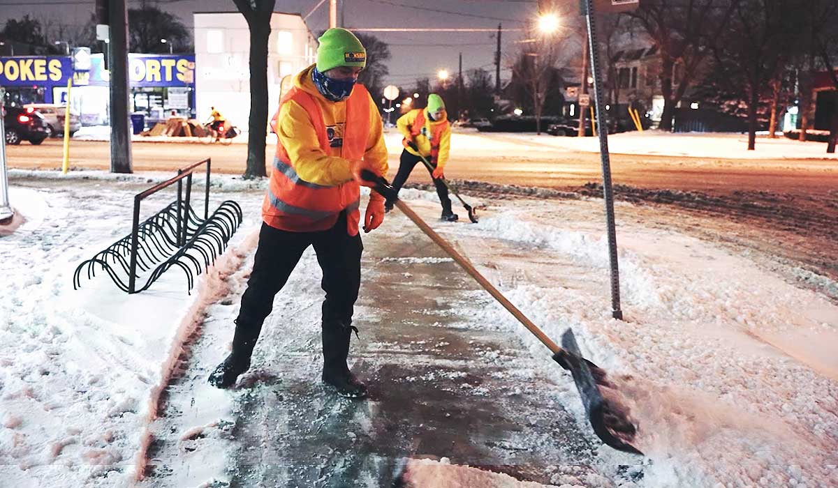 utilizing a combination of salt and sand applications